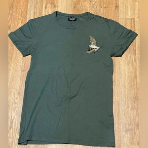 ZARA olive shirt with bird on right chest area.